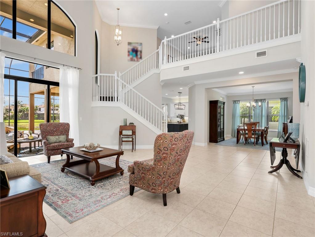2756 Crystal Way Naples, FL 34119 - Photo 7 of 50 a living room with furniture and a potted plant