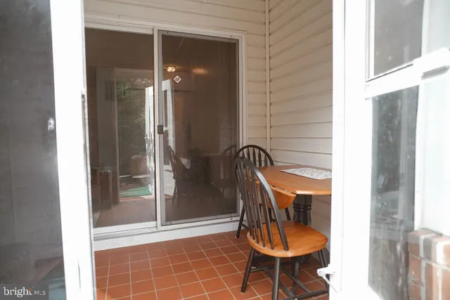 a room with table and chairs