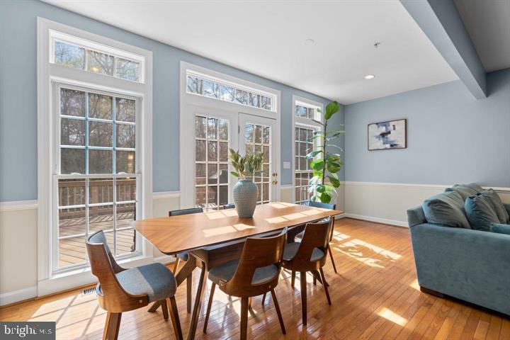 1556 Penzance Way Hanover, MD 21076 - Photo 13 of 40 a view of a dining room with furniture and wooden floor