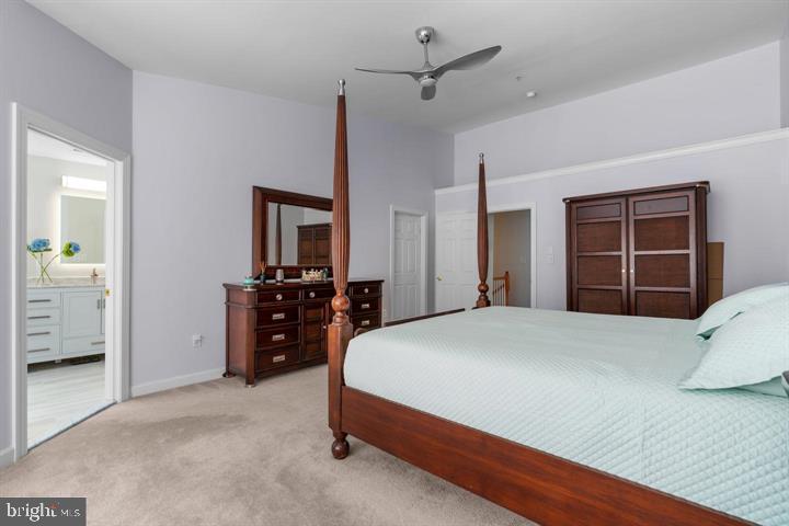 1556 Penzance Way Hanover, MD 21076 - Photo 18 of 40 a bedroom with a large bed and dresser