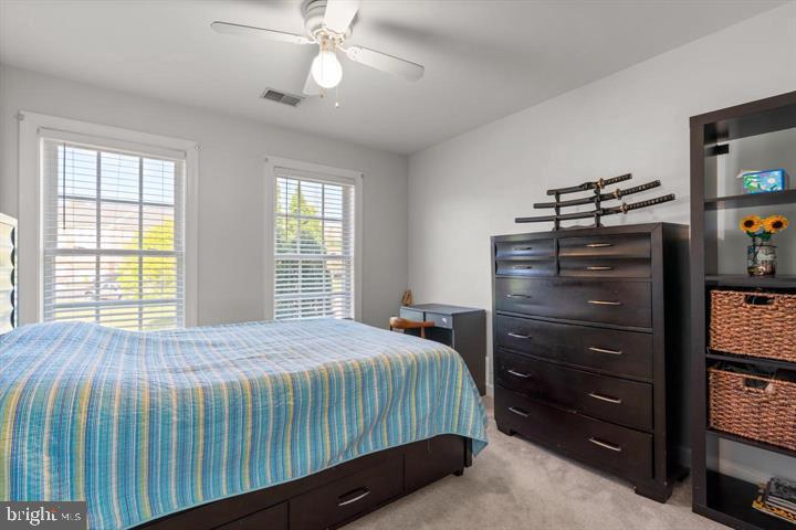 1556 Penzance Way Hanover, MD 21076 - Photo 24 of 40 a bedroom with a bed and a flat tv screen