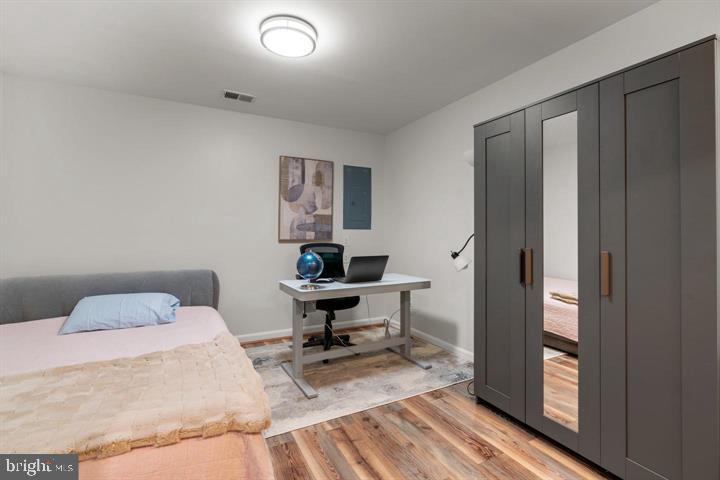 1556 Penzance Way Hanover, MD 21076 - Photo 32 of 40 a bedroom with a bed and a table