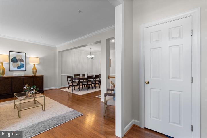1556 Penzance Way Hanover, MD 21076 - Photo 5 of 40 a living room with furniture and a table with wooden floor