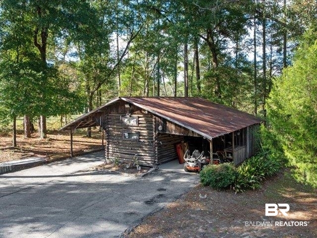 4650 Wiggins Lane Wilmer, AL 36587 - Photo 53 of 66 View of parking with a carport and driveway