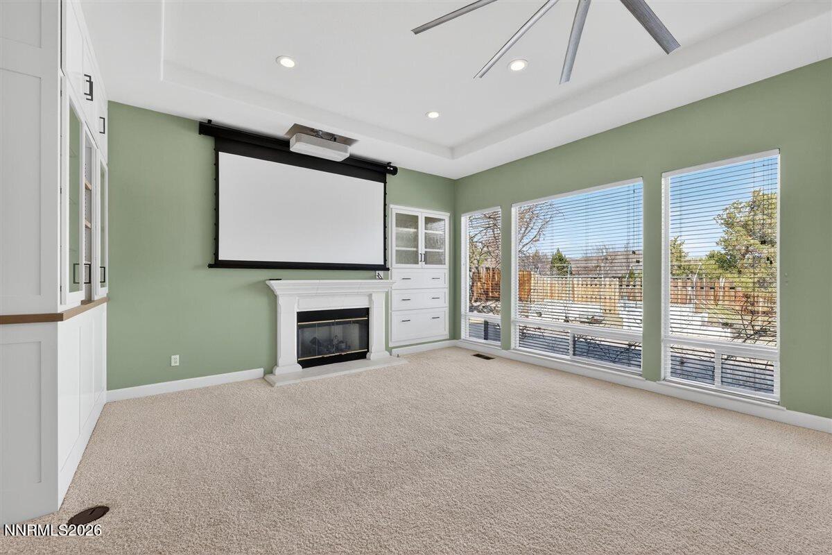 2214 St George Way Carson City, NV 89703 - Photo 11 of 57 a view of an empty room with a fireplace and a large window
