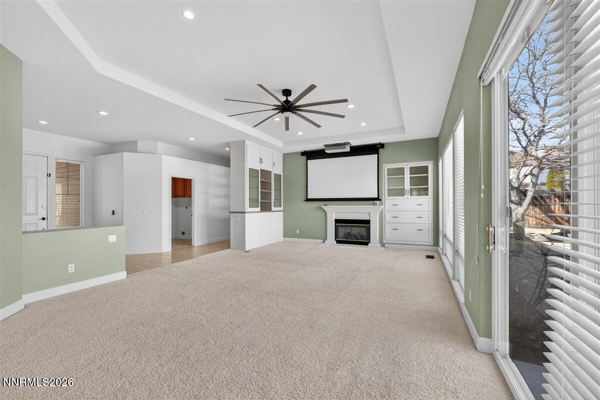 2214 St George Way Carson City, NV 89703 - Photo 12 of 57 a view of an empty room with a fireplace and a window