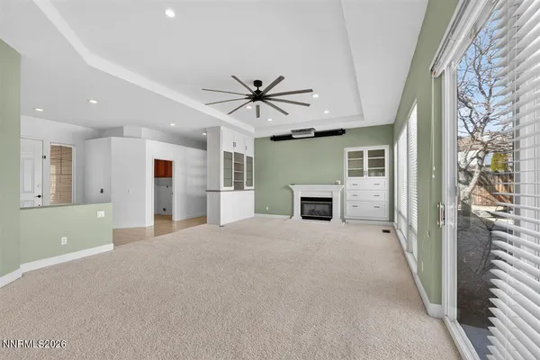 a view of an empty room with windows