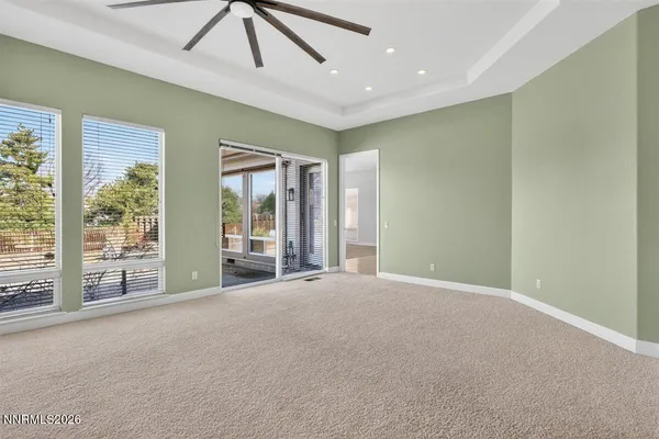 a view of livingroom with furniture fireplace and window