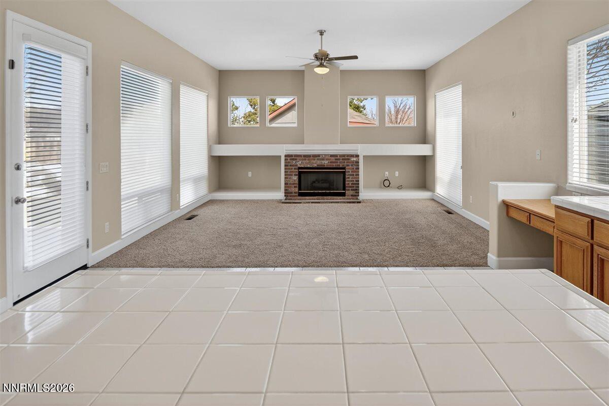 2214 St George Way Carson City, NV 89703 - Photo 19 of 57 a view of a livingroom with a fireplace and window