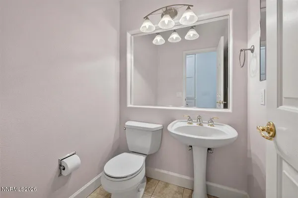 an empty room with closet and a ceiling fan