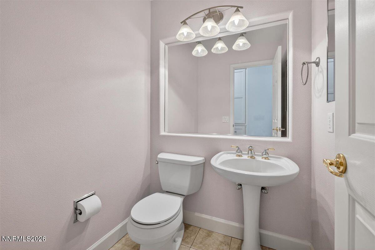 2214 St George Way Carson City, NV 89703 - Photo 24 of 57 a bathroom with a sink toilet and a mirror