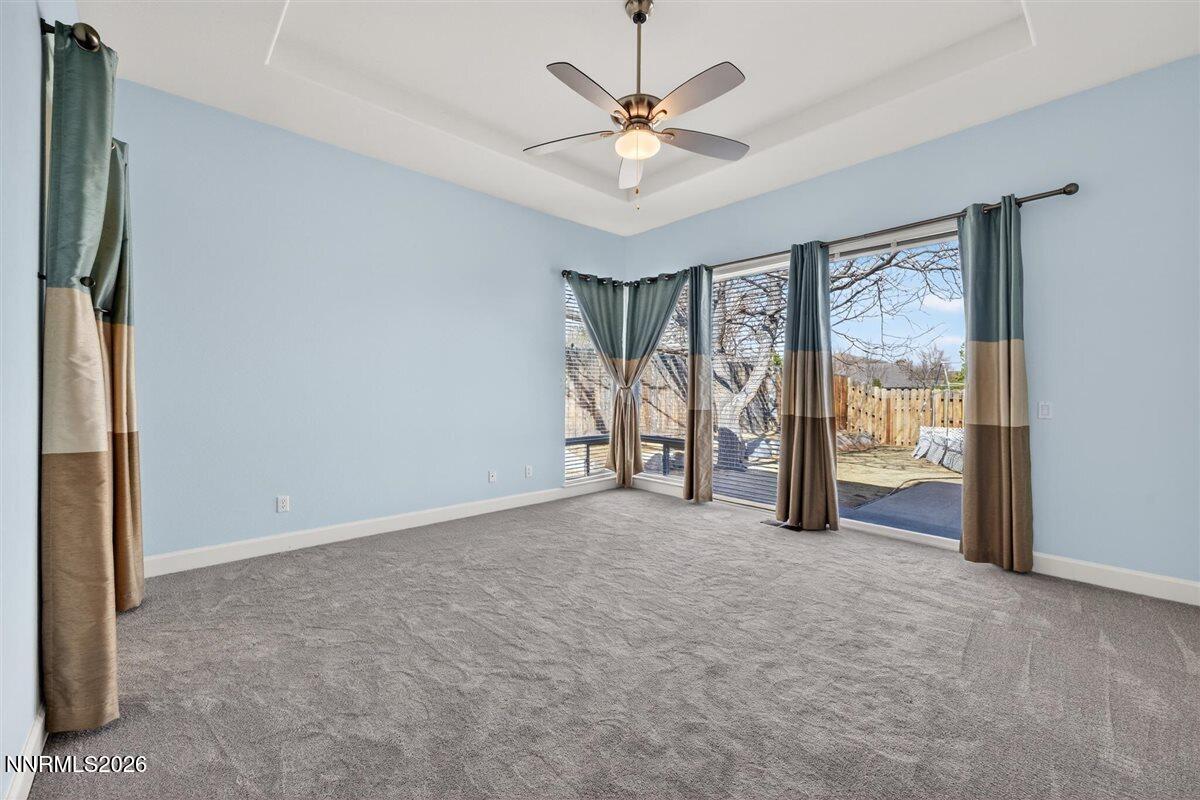 2214 St George Way Carson City, NV 89703 - Photo 25 of 57 an empty room with chandelier fan and windows