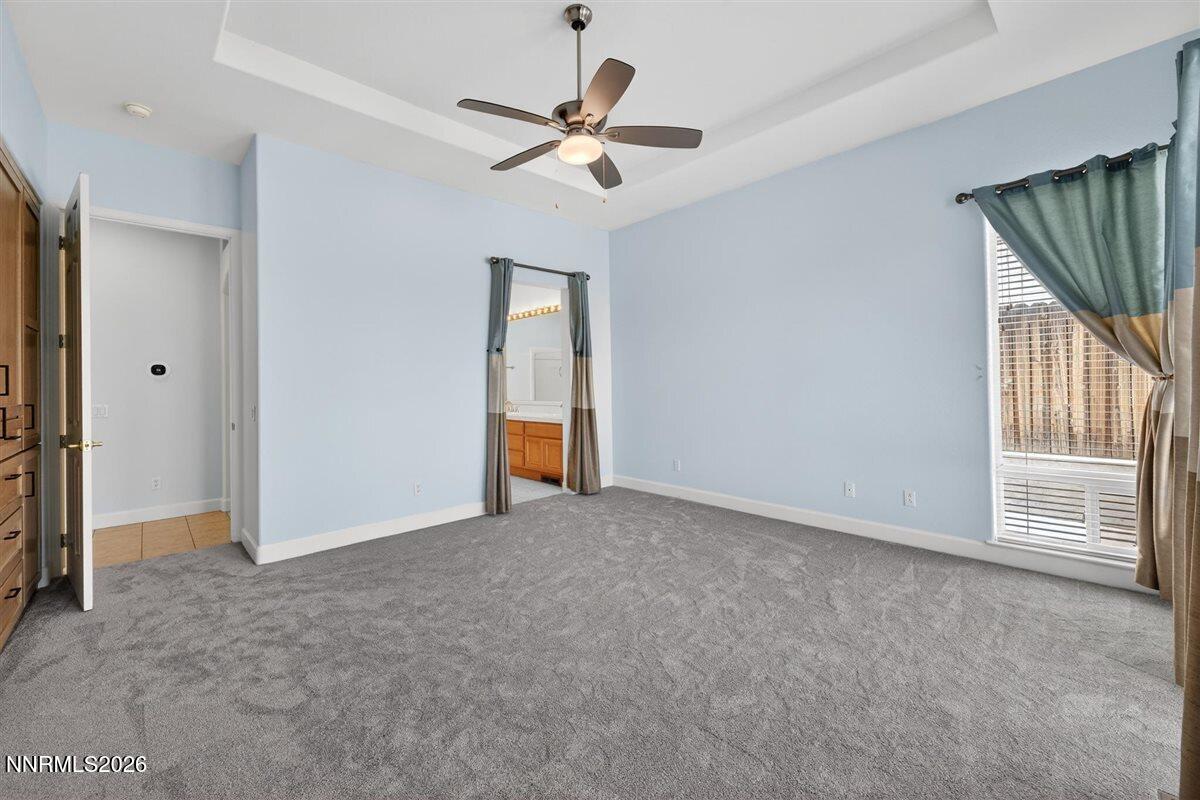 2214 St George Way Carson City, NV 89703 - Photo 26 of 57 an empty room with closet and a ceiling fan