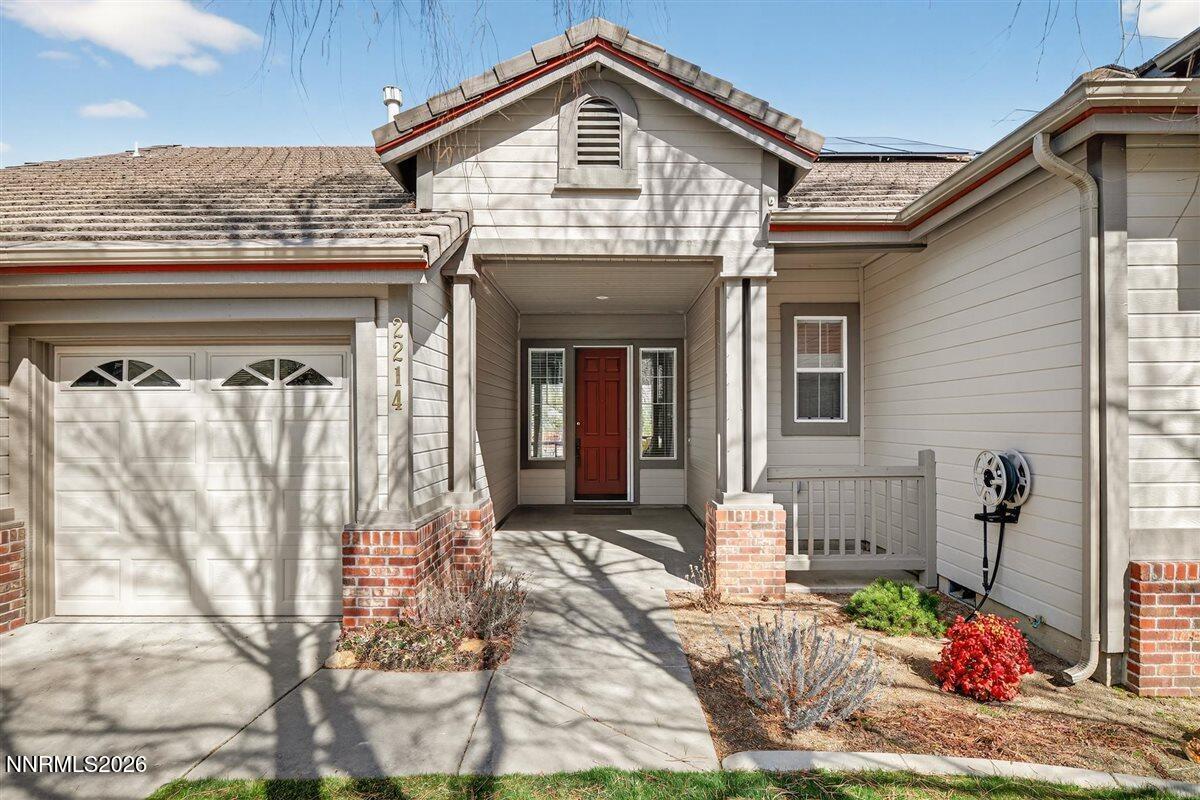 2214 St George Way Carson City, NV 89703 - Photo 5 of 57 a front view of a house with garden