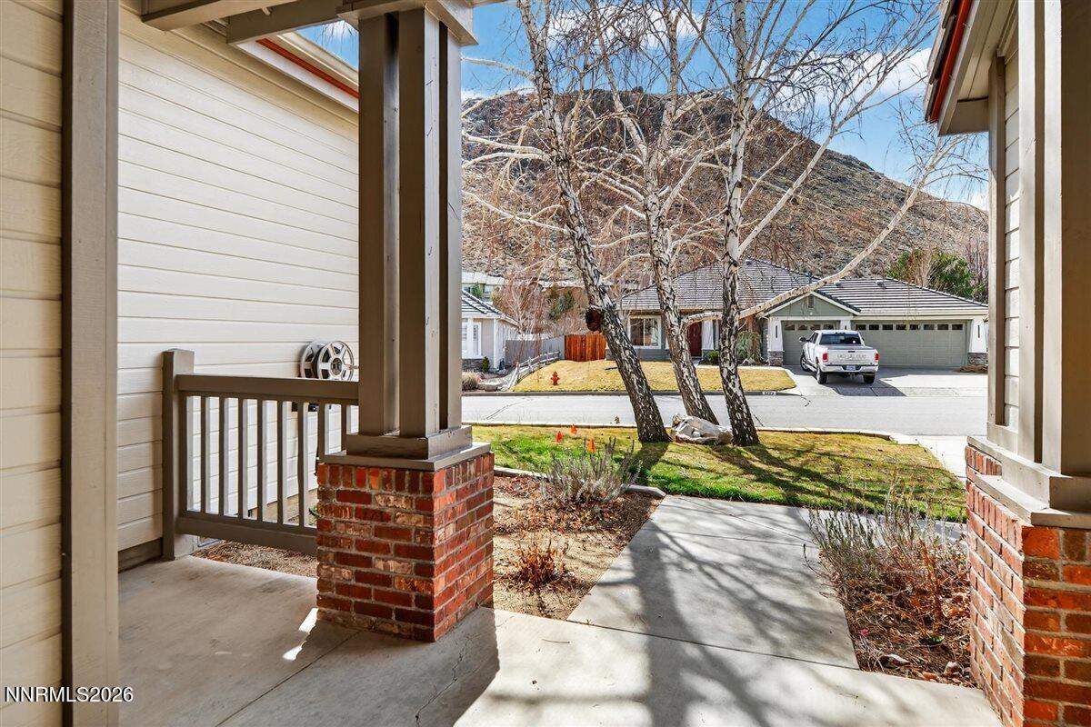 2214 St George Way Carson City, NV 89703 - Photo 6 of 57 a view of a patio with table and chairs and potted plants