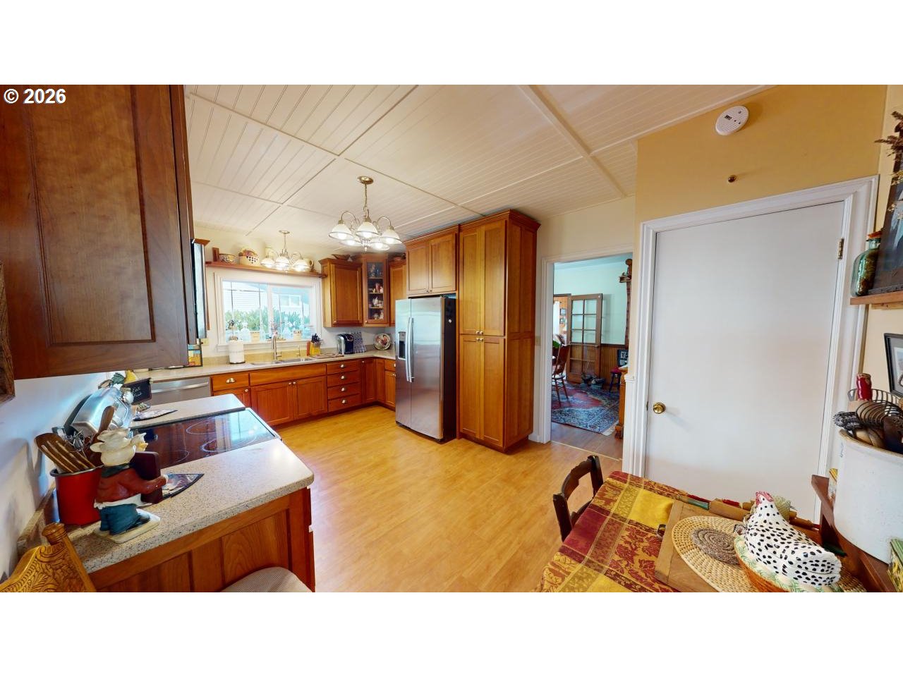 94361 Wedderburn Loop Gold Beach, OR 97444 - Photo 12 of 35 a living room with furniture and a flat screen tv