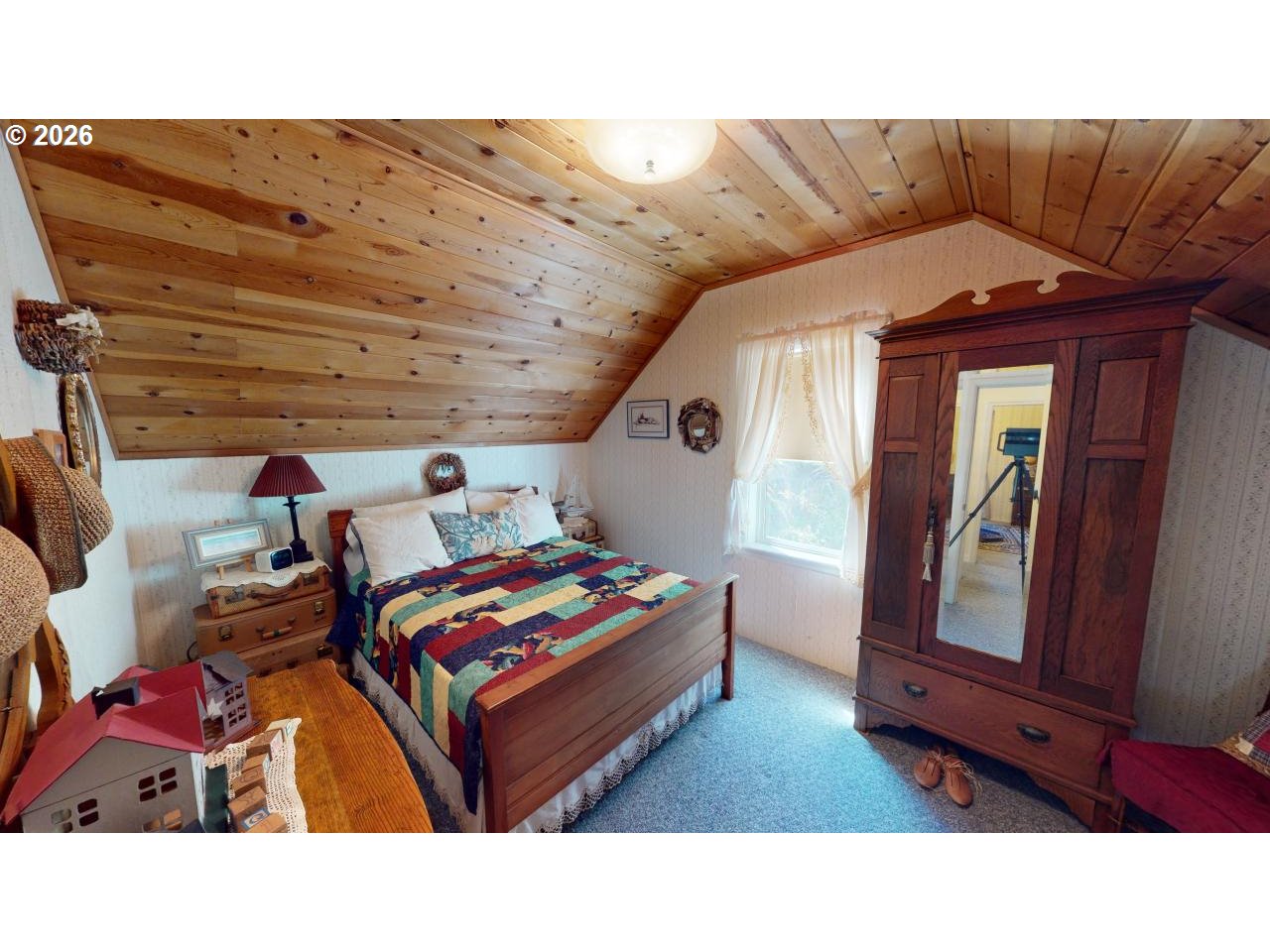 94361 Wedderburn Loop Gold Beach, OR 97444 - Photo 19 of 35 a living room with a bed and furniture