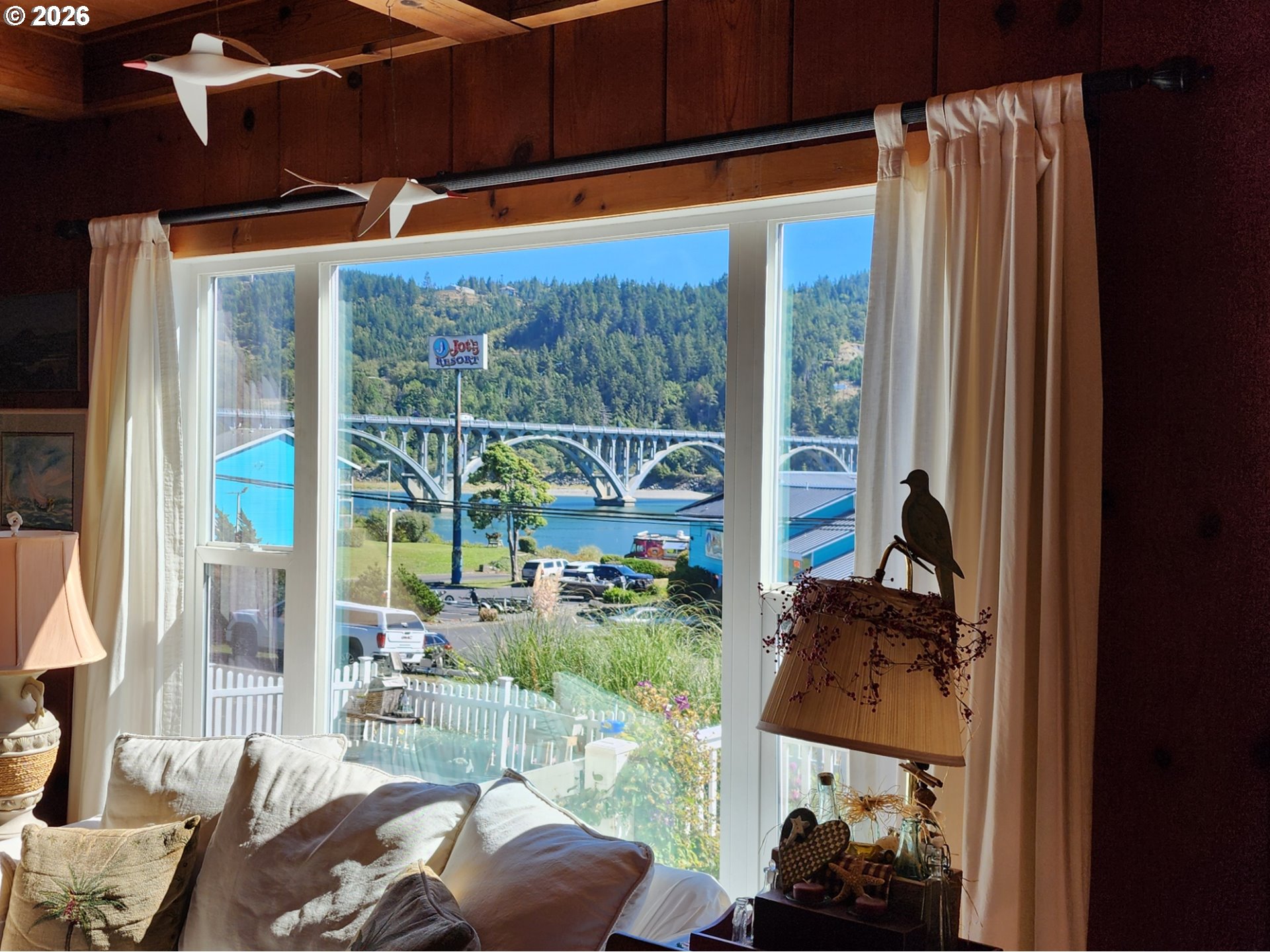 94361 Wedderburn Loop Gold Beach, OR 97444 - Photo 5 of 35 a room with furniture and a large window