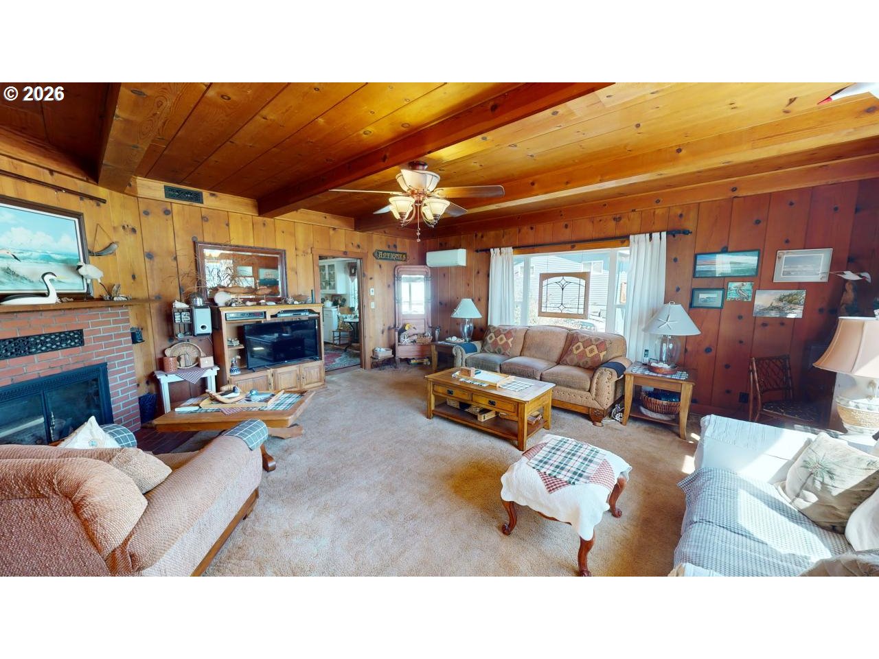 94361 Wedderburn Loop Gold Beach, OR 97444 - Photo 7 of 35 a living room with furniture kitchen view and a large window