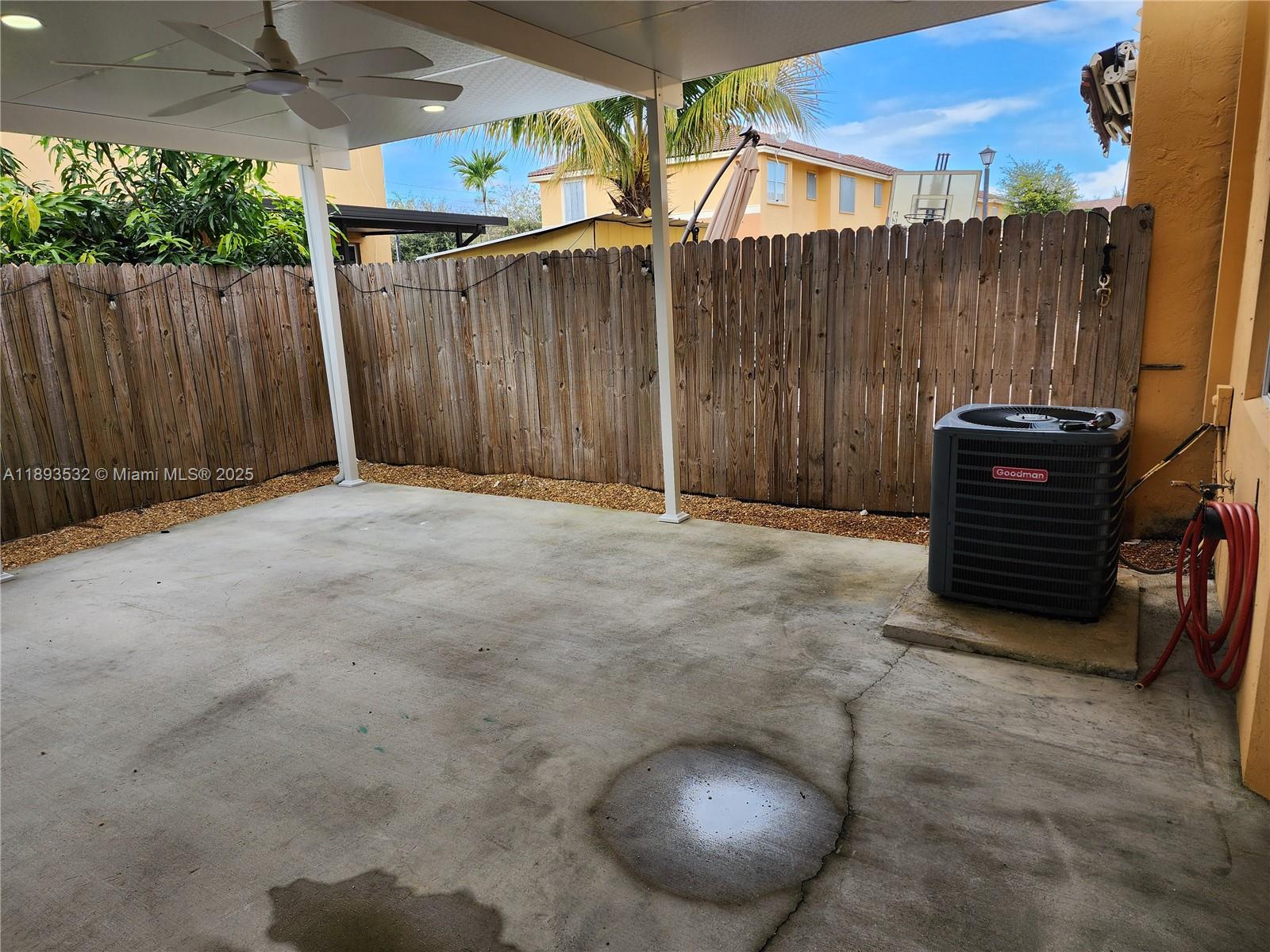 10831 Southwest 240th Lane Homestead, FL 33032 - Photo 11 of 33 a view of outdoor space and wooden fence