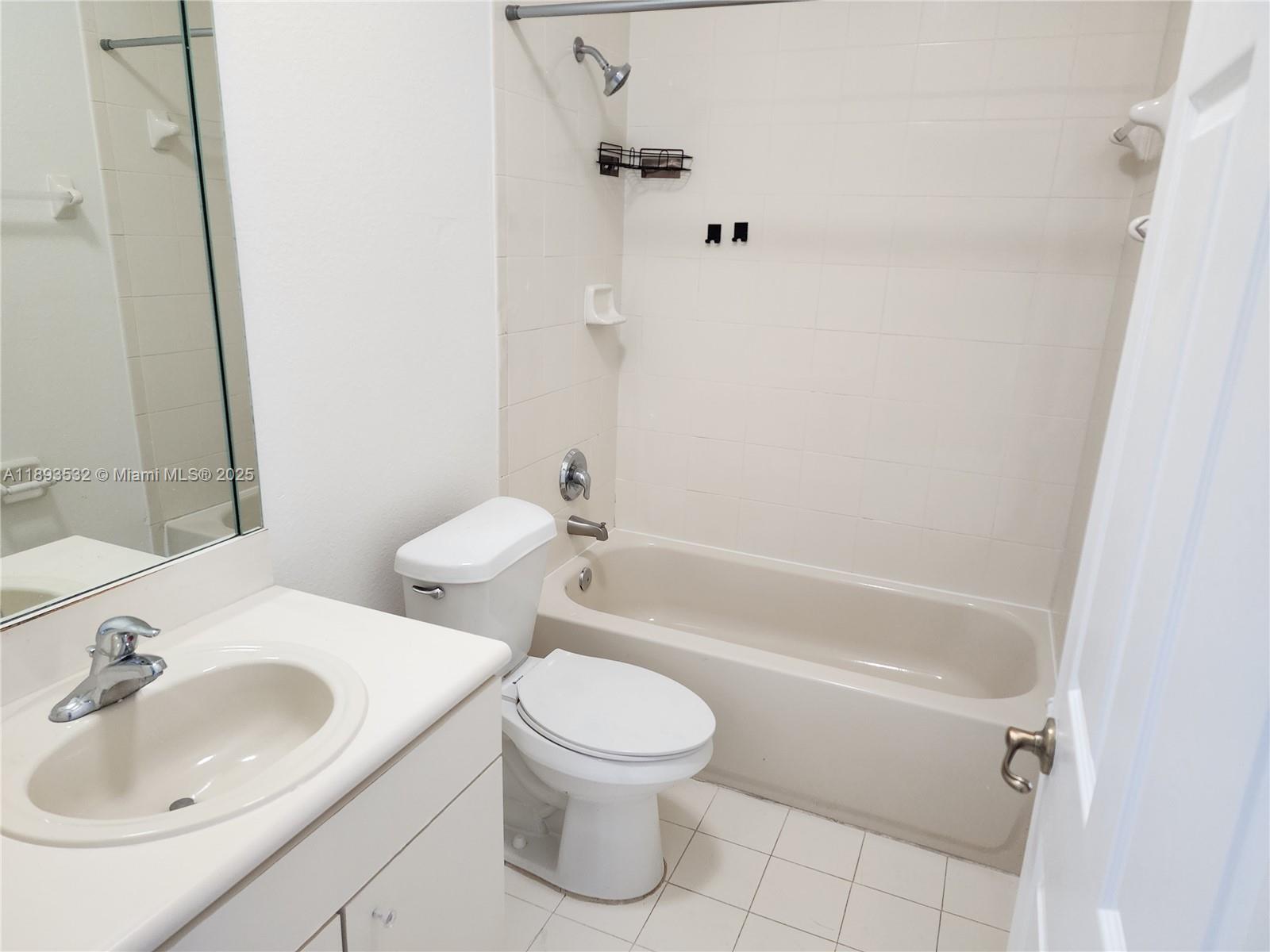 10831 Southwest 240th Lane Homestead, FL 33032 - Photo 19 of 33 a bathroom with a sink toilet and shower