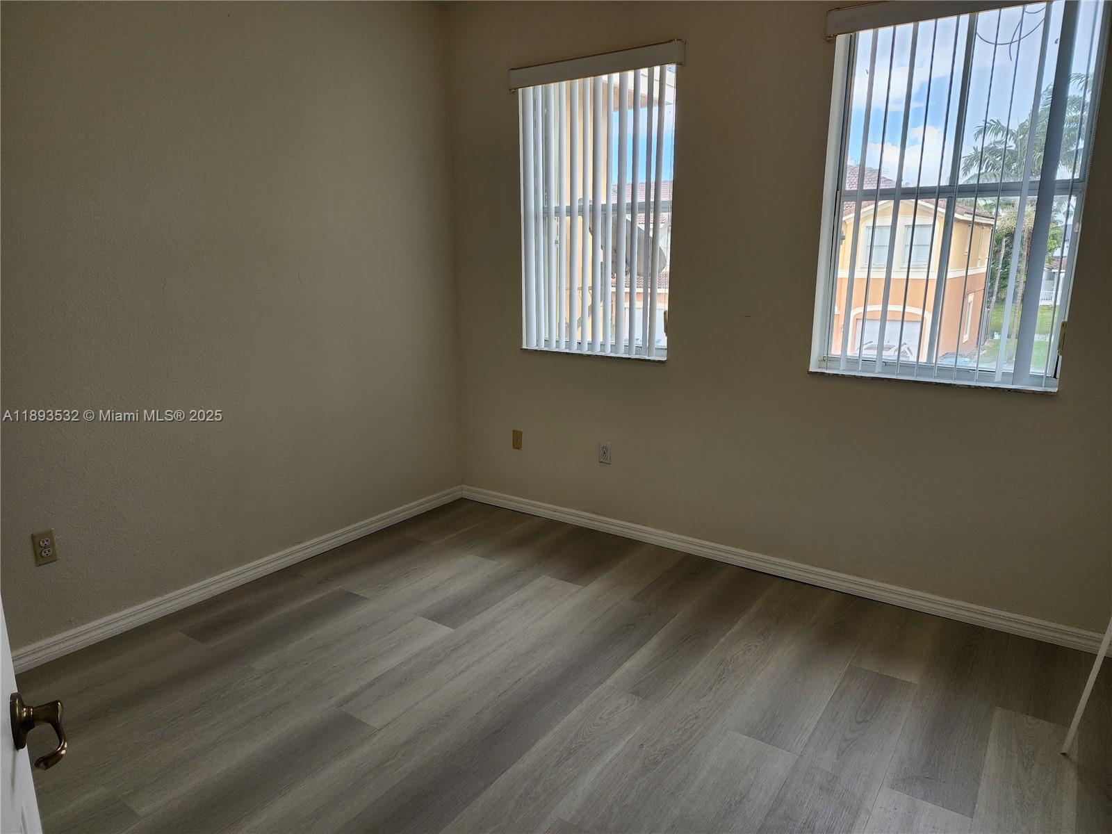 10831 Southwest 240th Lane Homestead, FL 33032 - Photo 20 of 33 an empty room with a window