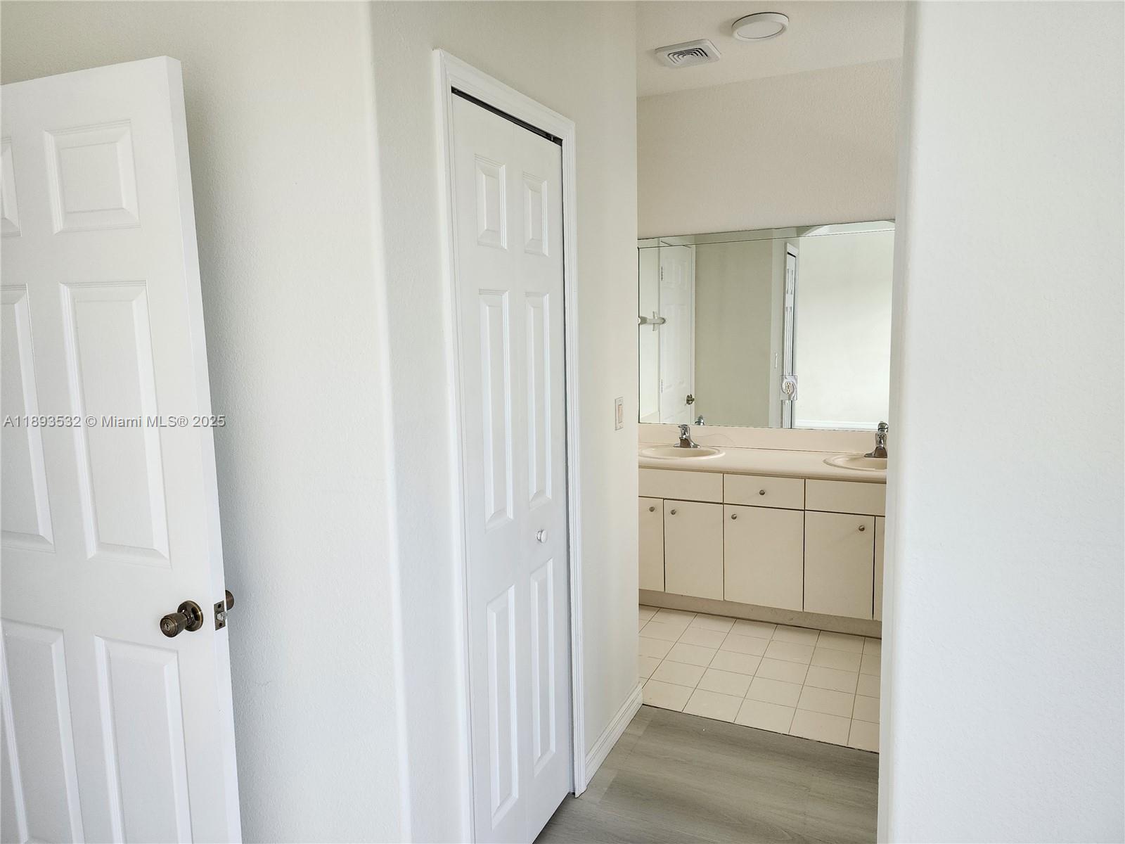 10831 Southwest 240th Lane Homestead, FL 33032 - Photo 23 of 33 a bathroom with a sink a toilet and a mirror