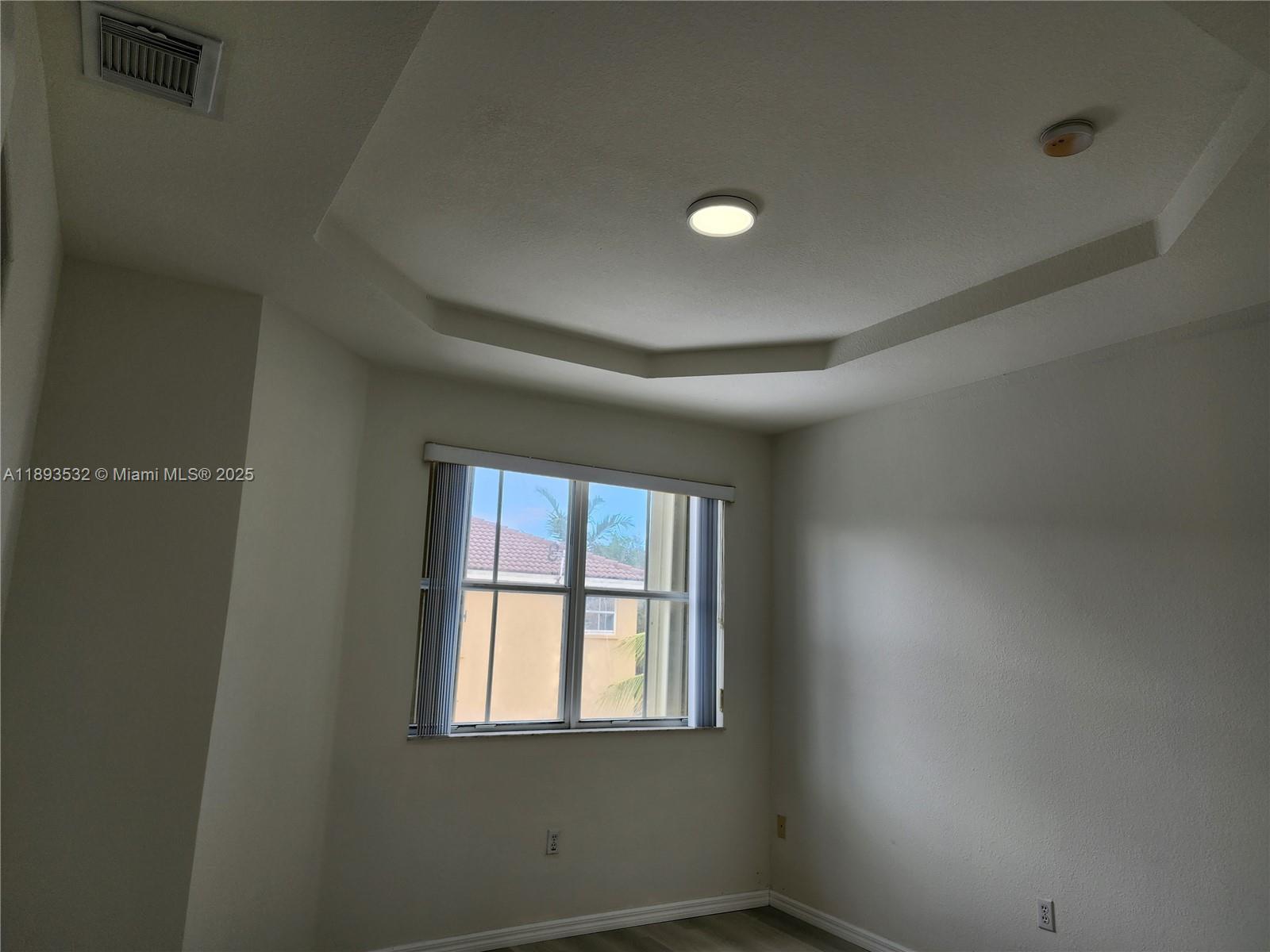 10831 Southwest 240th Lane Homestead, FL 33032 - Photo 28 of 33 an empty room with a window