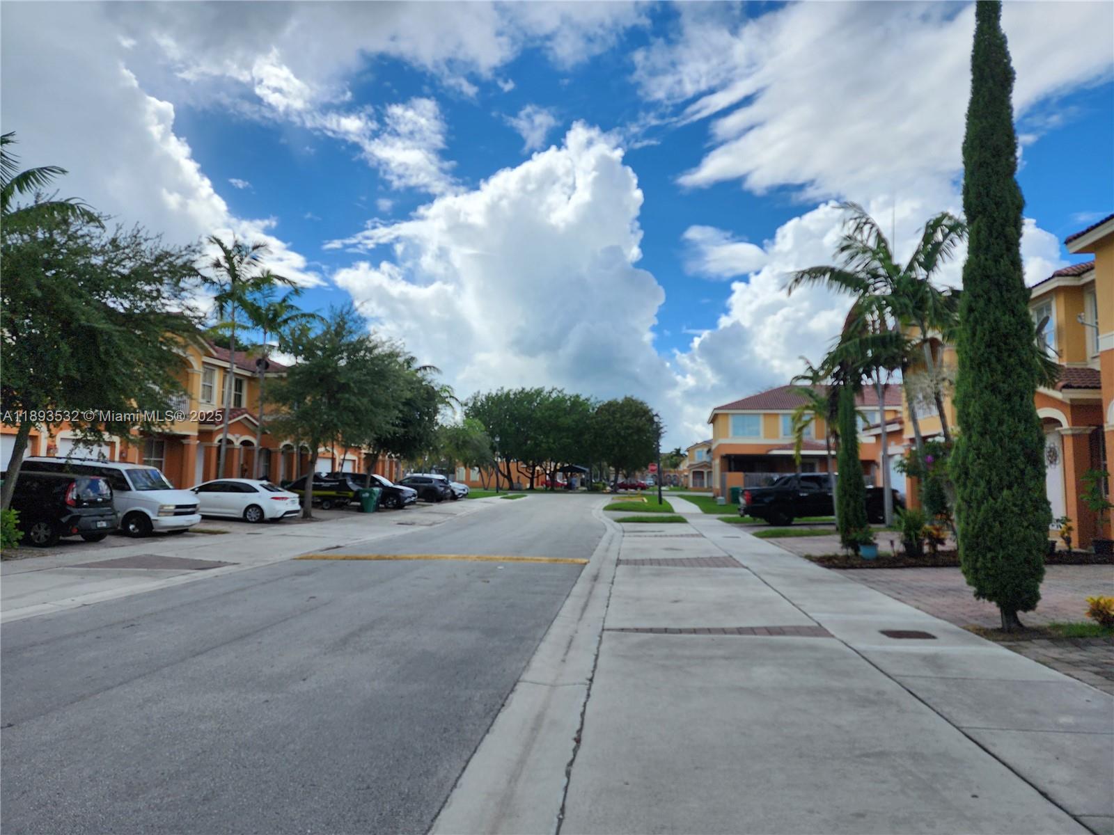 10831 Southwest 240th Lane Homestead, FL 33032 - Photo 3 of 33 a view of a street
