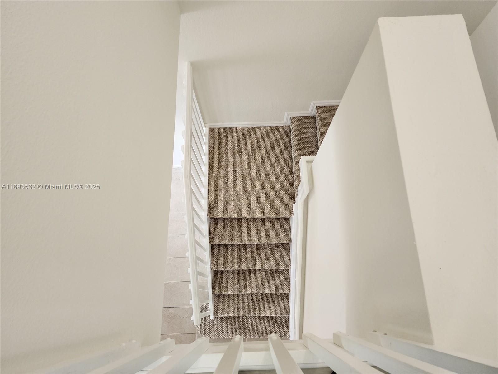 10831 Southwest 240th Lane Homestead, FL 33032 - Photo 31 of 33 a view of walk in closet with empty racks