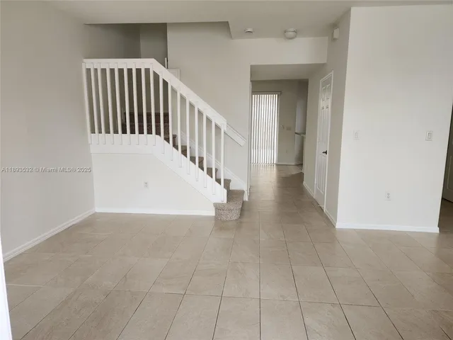 a view of a hallway with entryway