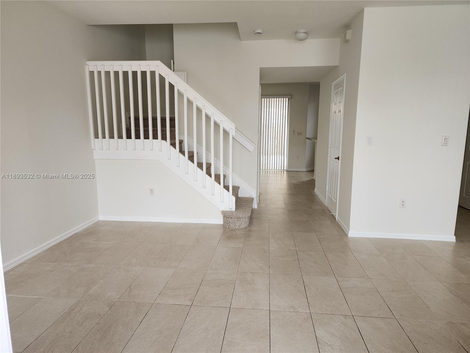 10831 Southwest 240th Lane Homestead, FL 33032 - Photo 4 of 33 a view of a hallway with entryway
