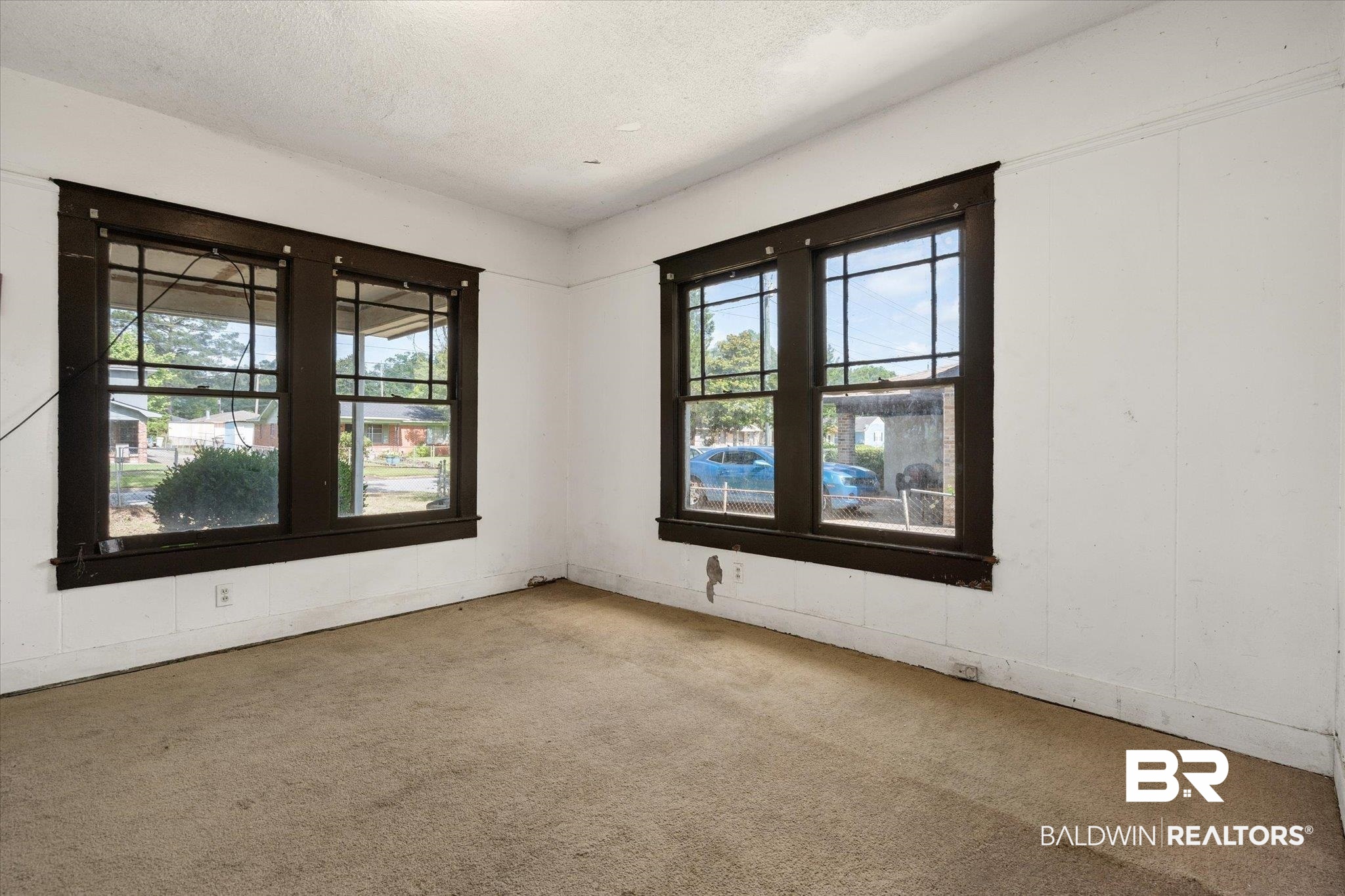 672 Burden Street Mobile, AL 36607 - Photo 15 of 20 Carpeted empty room with plenty of natural light and a textured ceiling