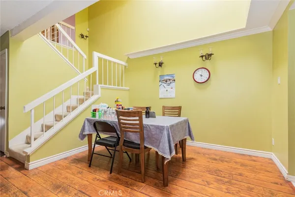 a view of a dining room with furniture and a table