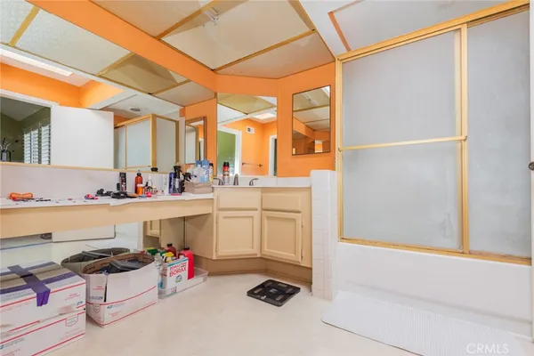 a kitchen with a sink and a refrigerator