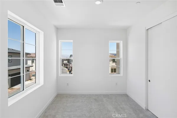 an empty room with windows