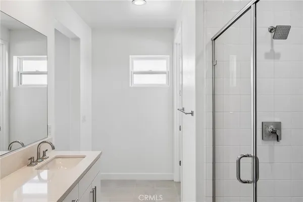 a bathroom with a sink and mirror