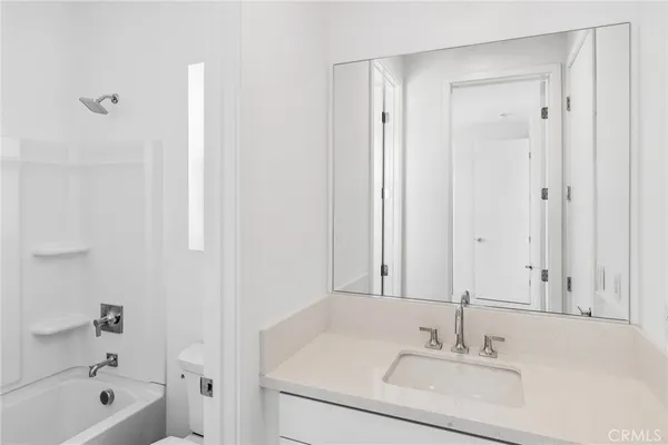 a bathroom with a sink and a bathtub