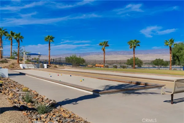 a view of a street with palm trees