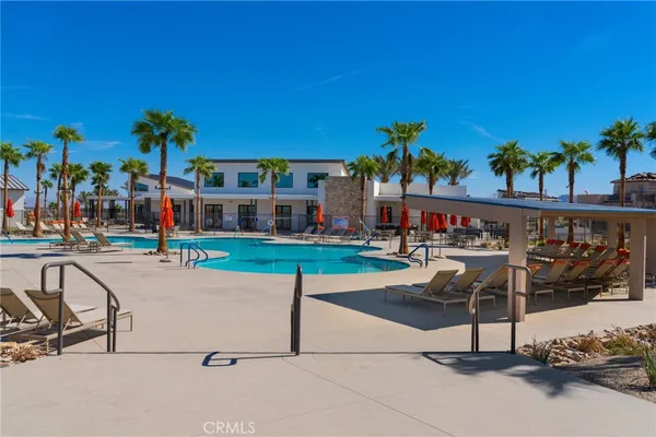 a view of a chairs and table in the patio