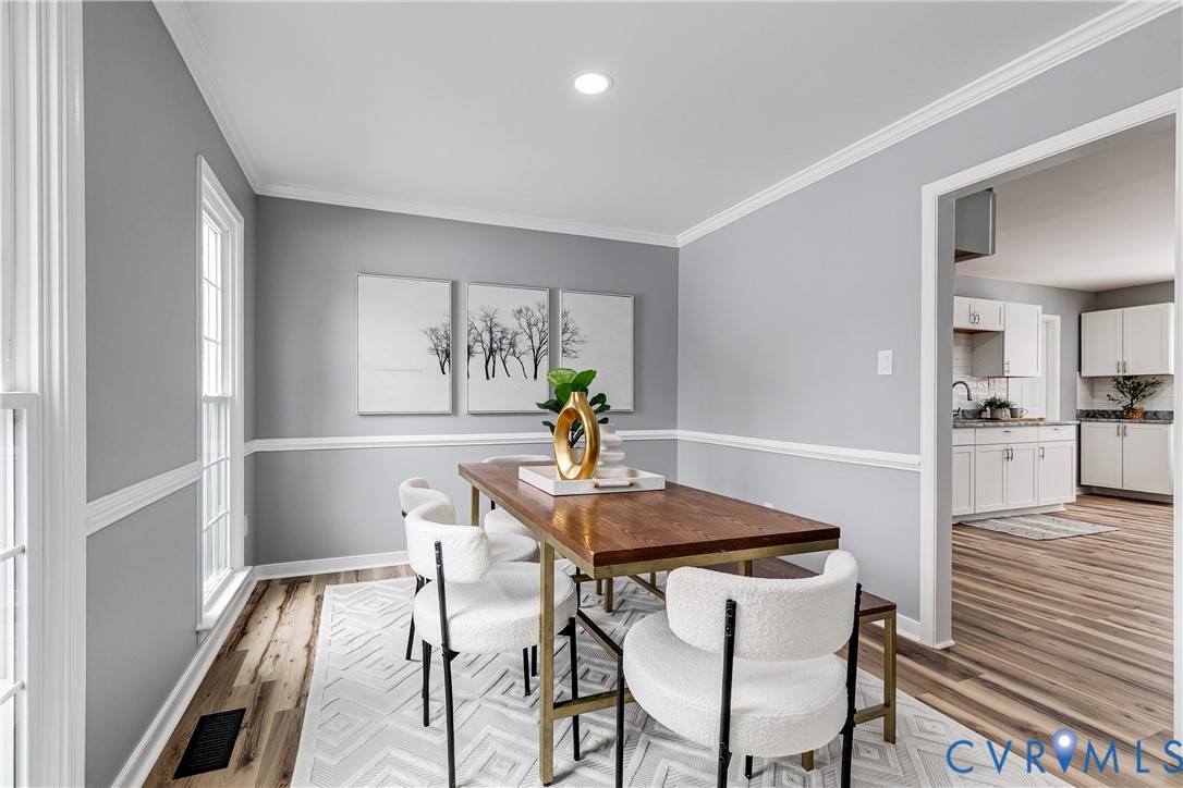 7112 Harbourside Court Midlothian, VA 23112 - Photo 14 of 49 a view of a dining room with furniture and wooden floor