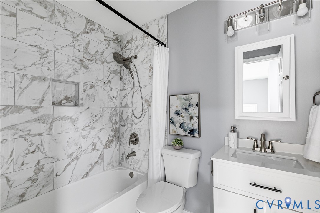 7112 Harbourside Court Midlothian, VA 23112 - Photo 44 of 49 a bathroom with a sink toilet and shower