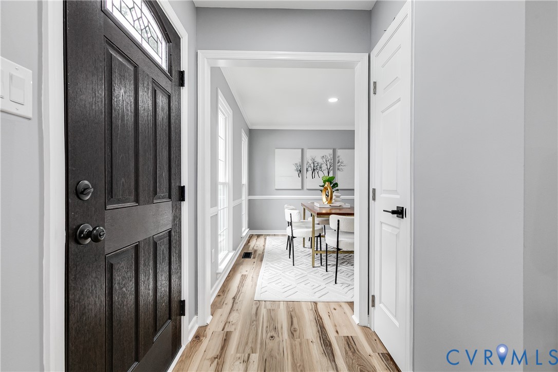 7112 Harbourside Court Midlothian, VA 23112 - Photo 5 of 49 a view of a hallway with wooden floor and furniture