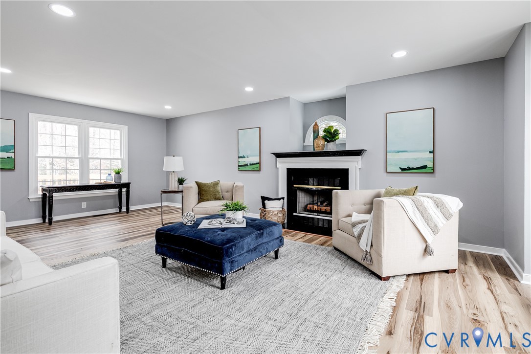 7112 Harbourside Court Midlothian, VA 23112 - Photo 6 of 49 a living room with furniture and a fireplace