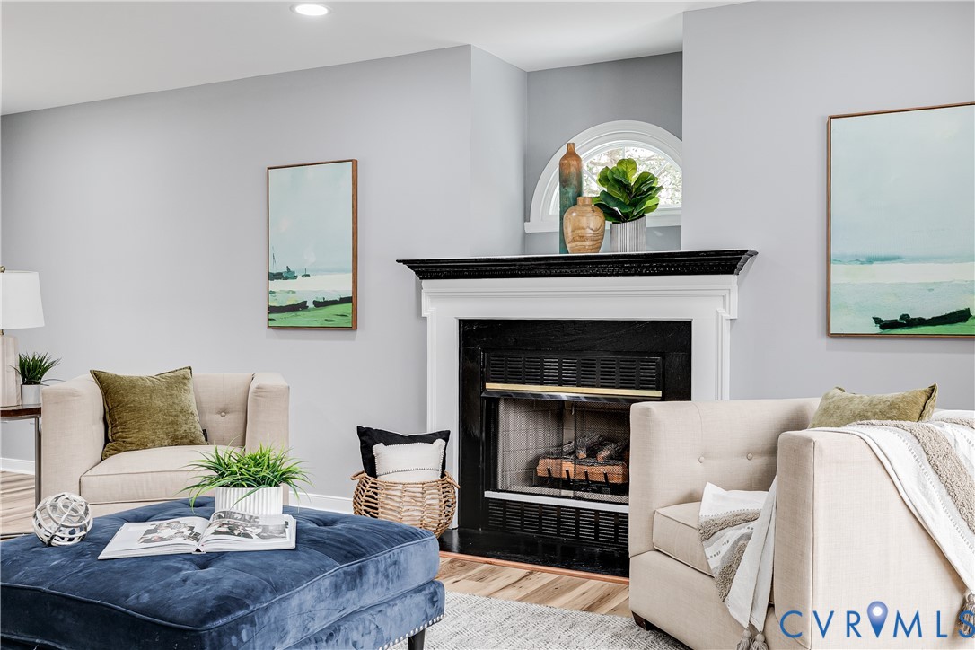 7112 Harbourside Court Midlothian, VA 23112 - Photo 7 of 49 a living room with furniture and a fireplace