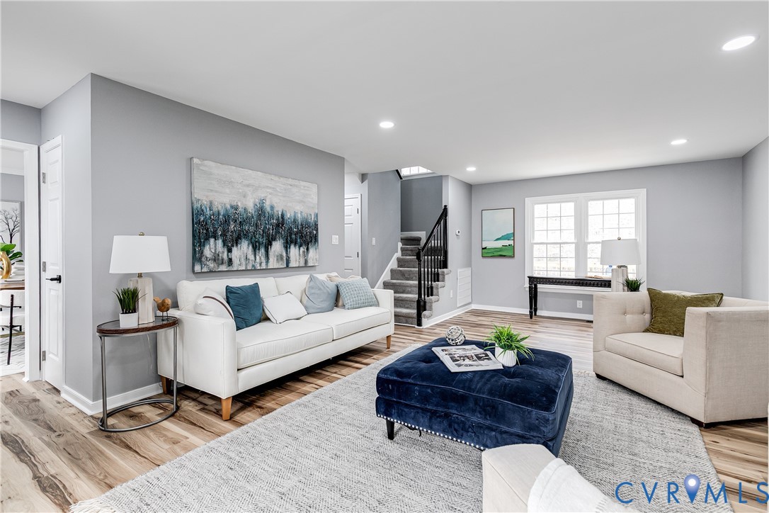 7112 Harbourside Court Midlothian, VA 23112 - Photo 9 of 49 a living room with furniture and a large window