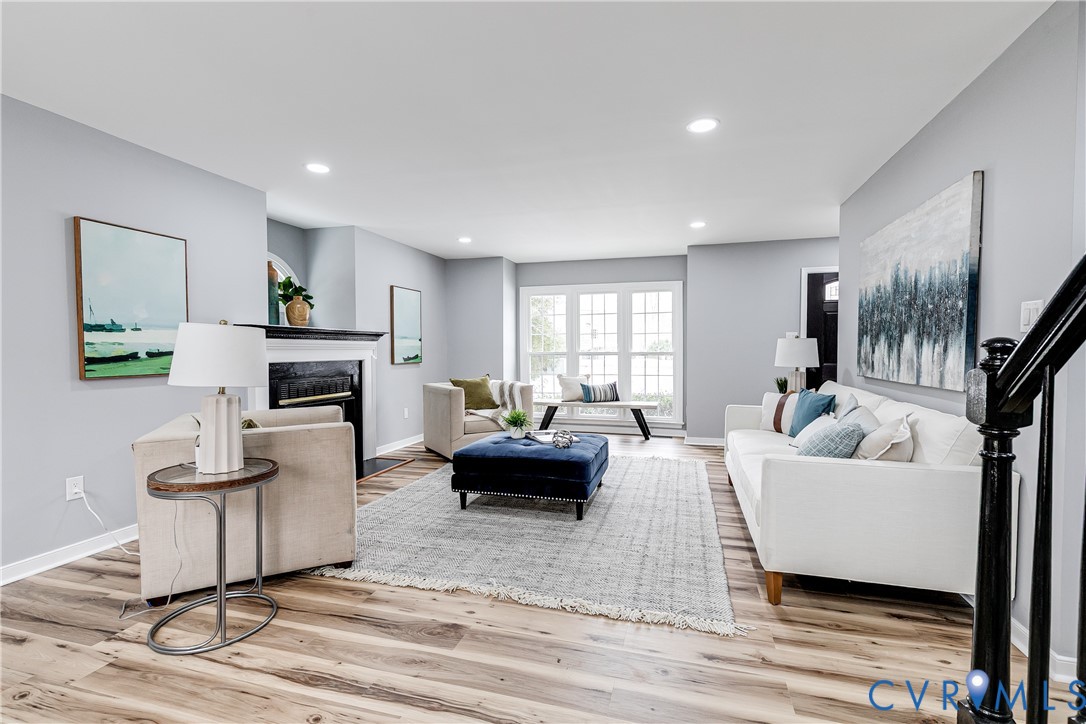 7112 Harbourside Court Midlothian, VA 23112 - Photo 10 of 49 a living room with fireplace furniture and a wooden floor