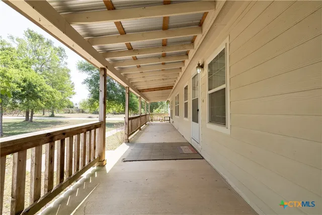a view of house with a patio