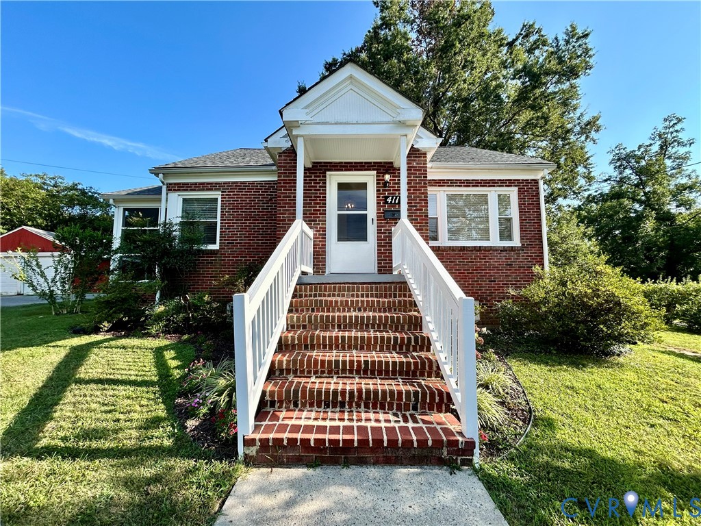 411 Hillcrest Avenue Colonial Heights, VA 23834 - Photo 1 of 33 front view of a house with a yard