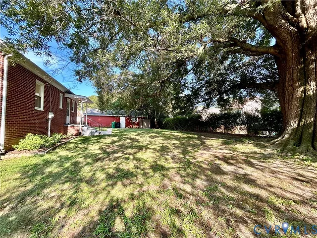 a kitchen with a stove a refrigerator and a sink
